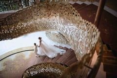 a bride and groom walking downstairs