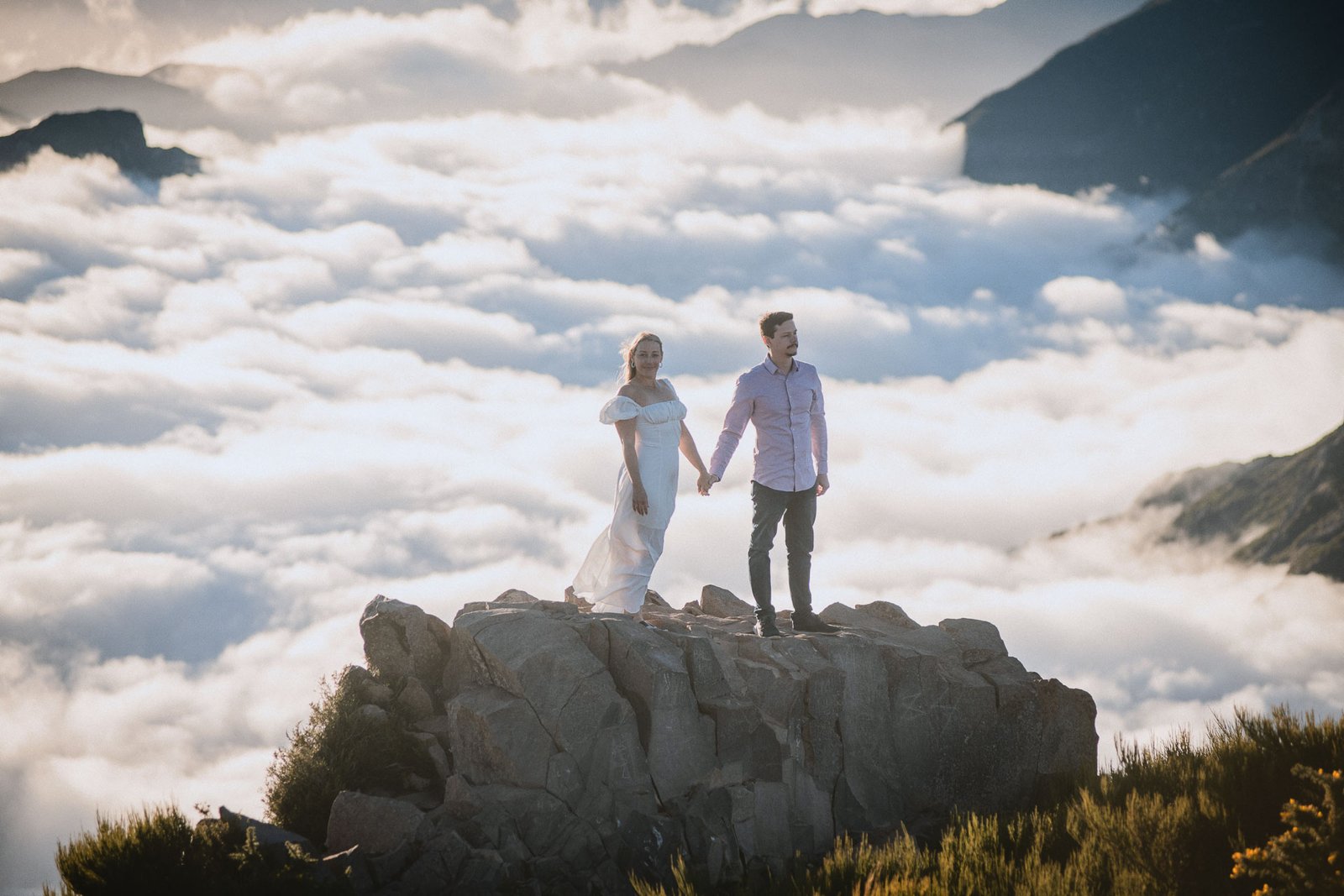 a couple in love holding hands above the clouds, Arieiro Peak, Madeira