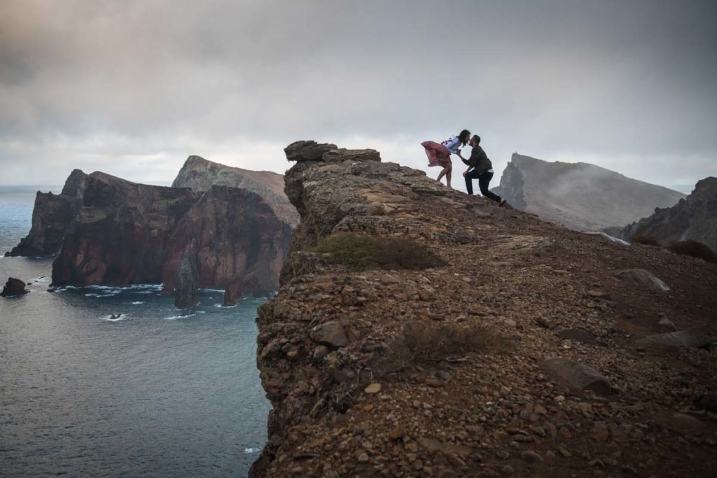 Couple on high cliff in Madeira