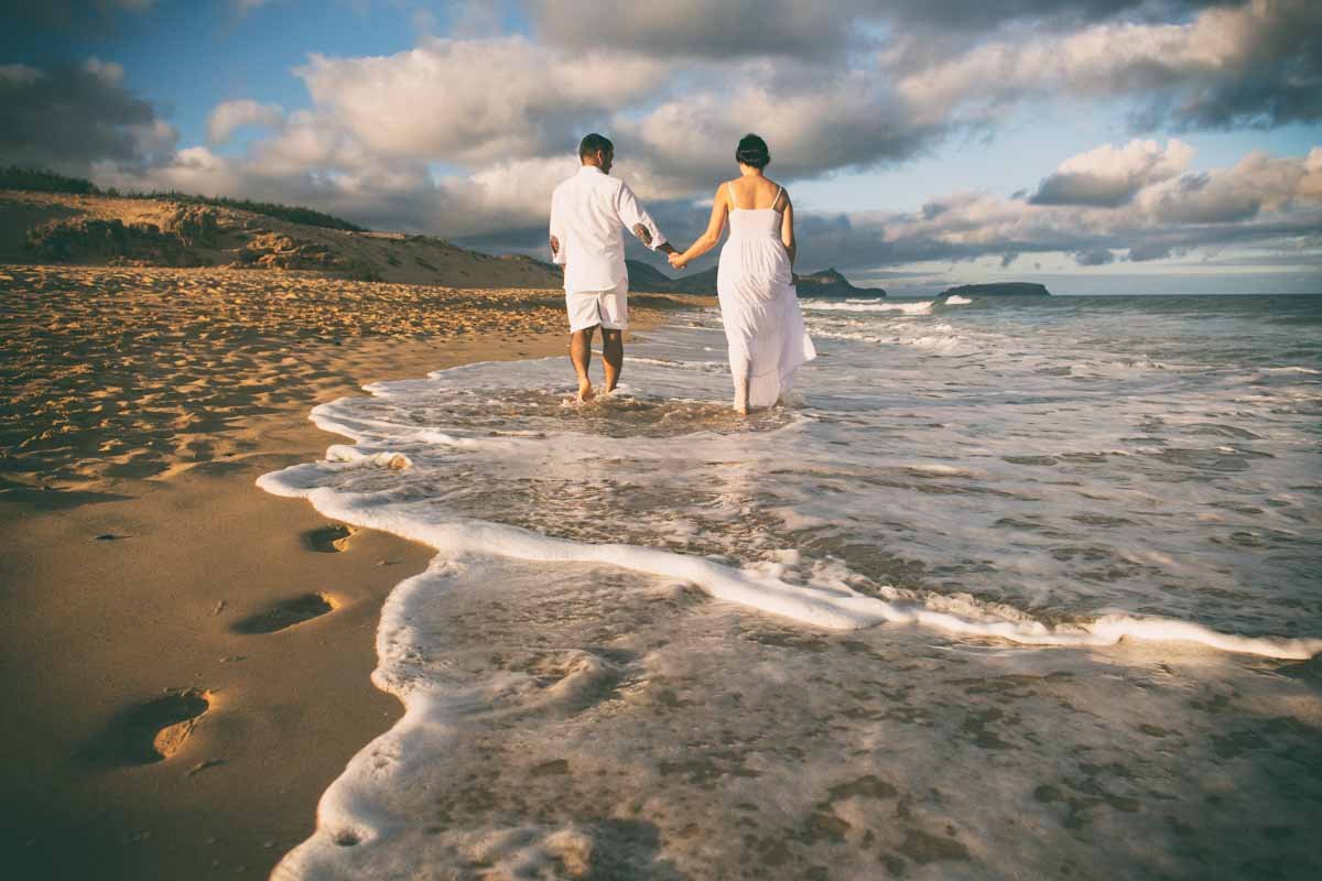 a couple walking in ocean