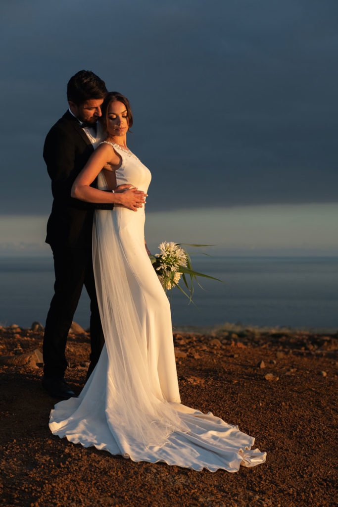 Groom holds a bride