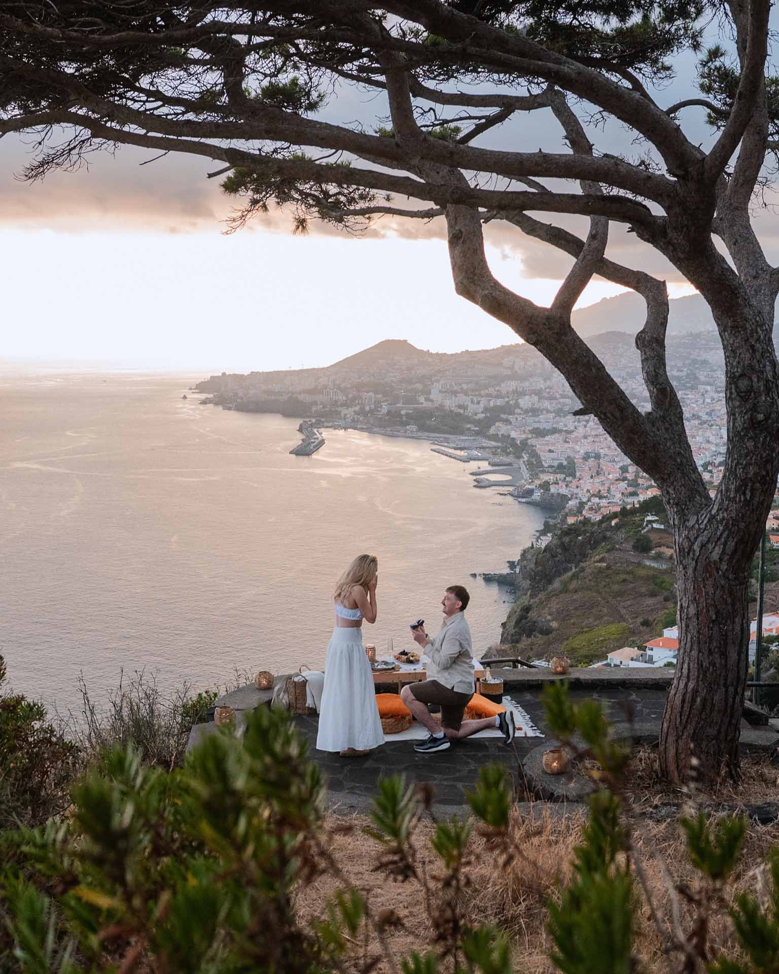 A marriage proposal in Funchal with sunset light and picnic decorations
