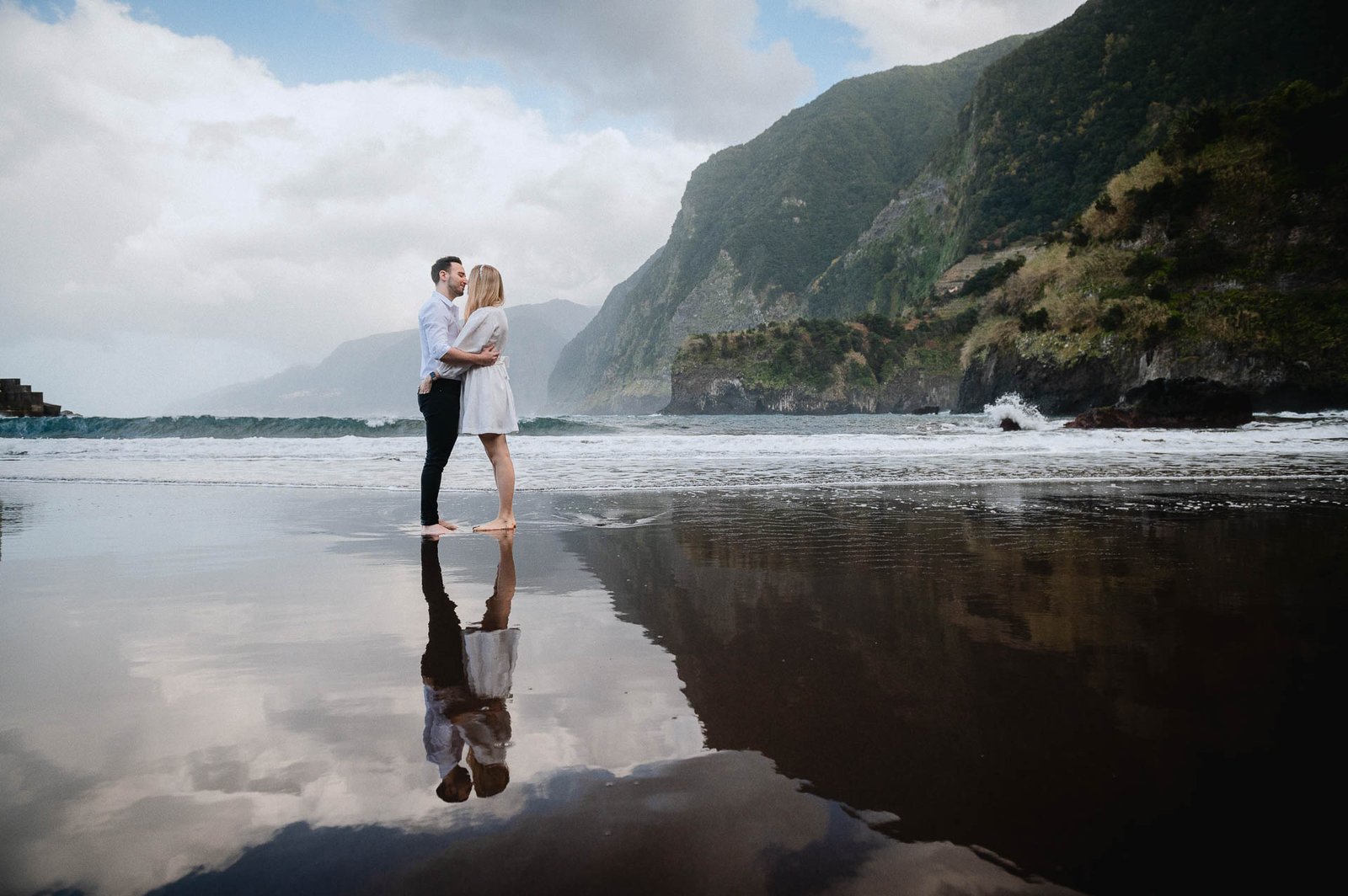 A couple kissing at Seixal beach, Madeira