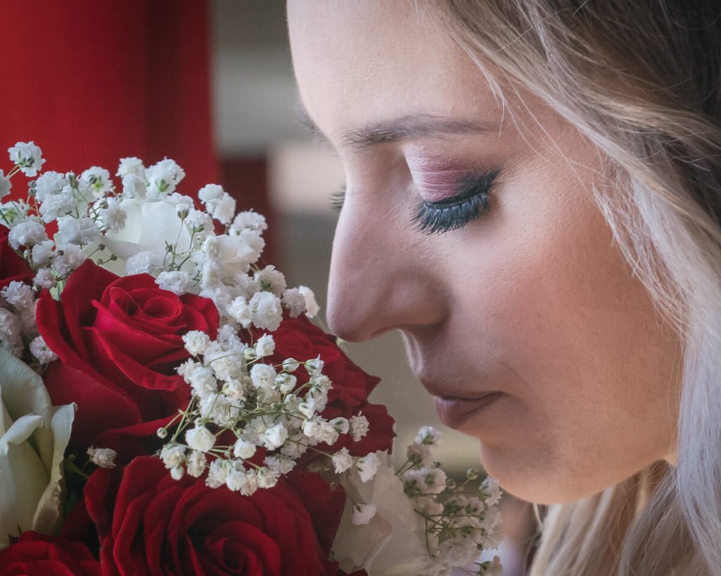 bride smelling flowers