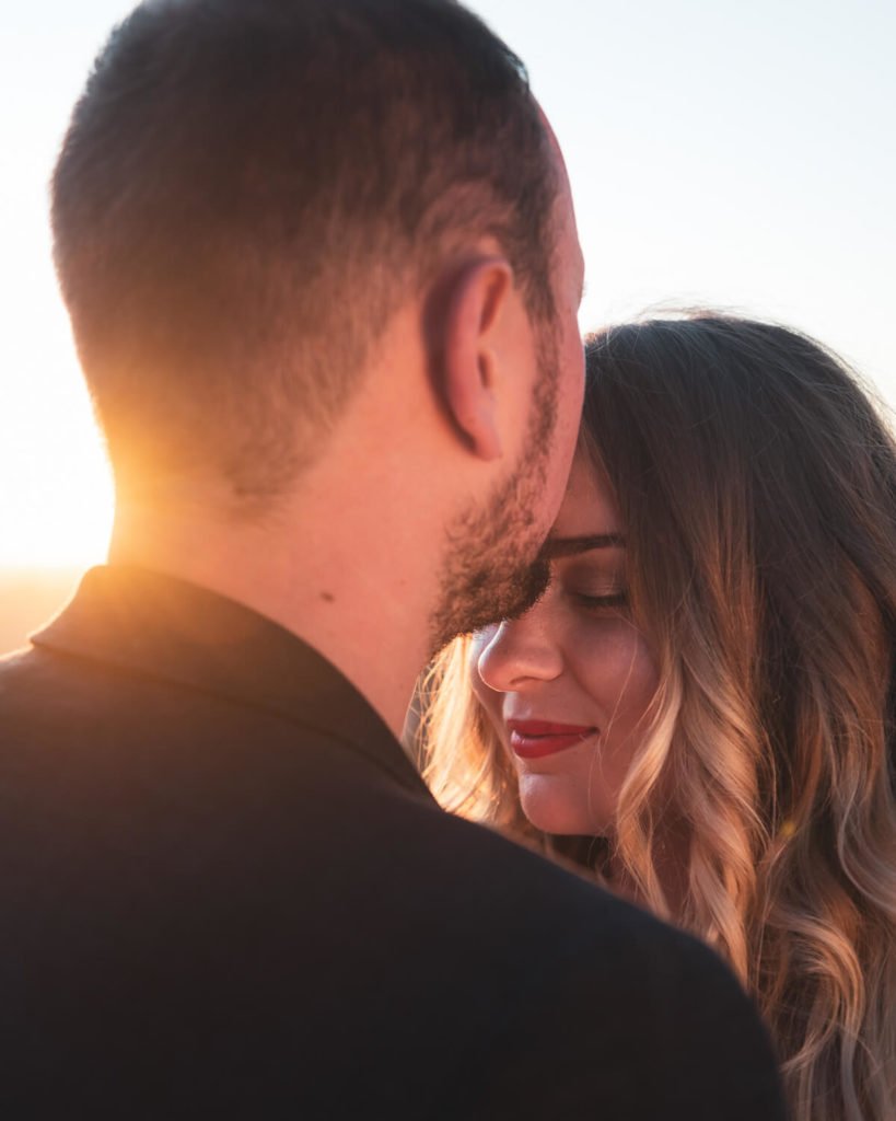 portrait of couple of newlyweds at sunset